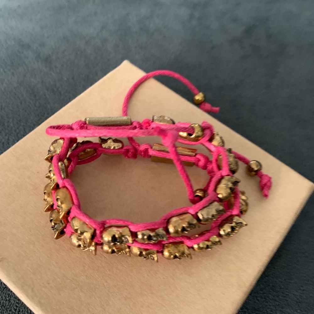NWOT 2 pink & gold skull bracelets